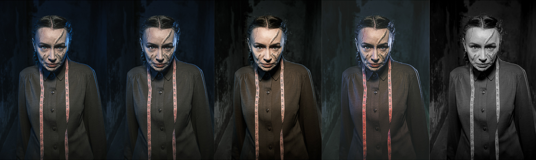 A five-panel promotional portrait series by a leading Cork-based theatre photographer Marcin Lewandowski, featuring actress Irene Kelleher in various color treatments. In each panel, Irene Kelleher stands facing forward, looking directly at the viewer with a stern expression. Her dark hair is pulled back in braids, and her face is adorned with theatrical makeup resembling prominent scars and stitches, particularly on her forehead and across her right cheek and nose. She wears a dark, long-sleeved shirt with buttons and a light pink measuring tape draped around her neck. The panels show different color treatments: from left to right, the first panel has a blue tint, the second has a subtle cool tone, the third is in natural colors, the fourth has a warm, reddish tint, and the fifth is in black and white. The background in all panels is dark and indistinct, hinting at a theatrical or slightly distressed setting.